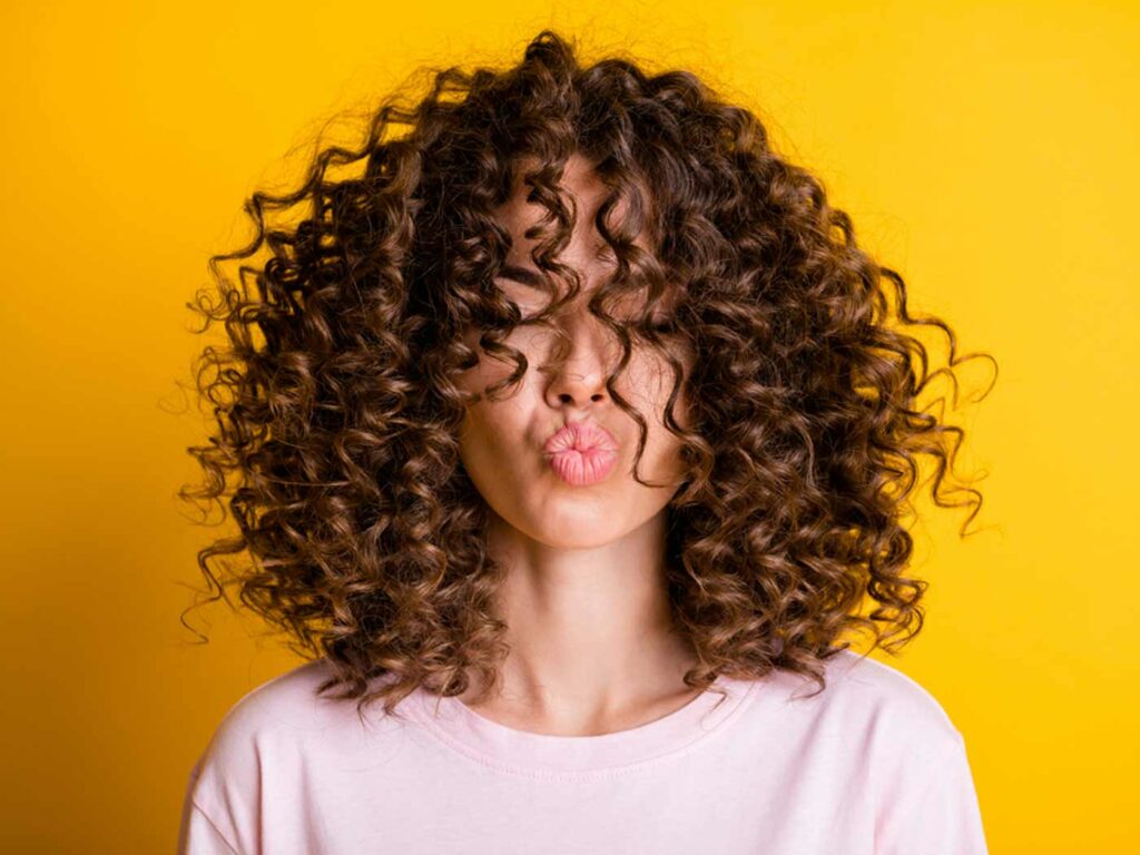 Embrace Your Natural Curls: Why Curly Girls Should Ditch Heat Styling Tools in Warmer Weather