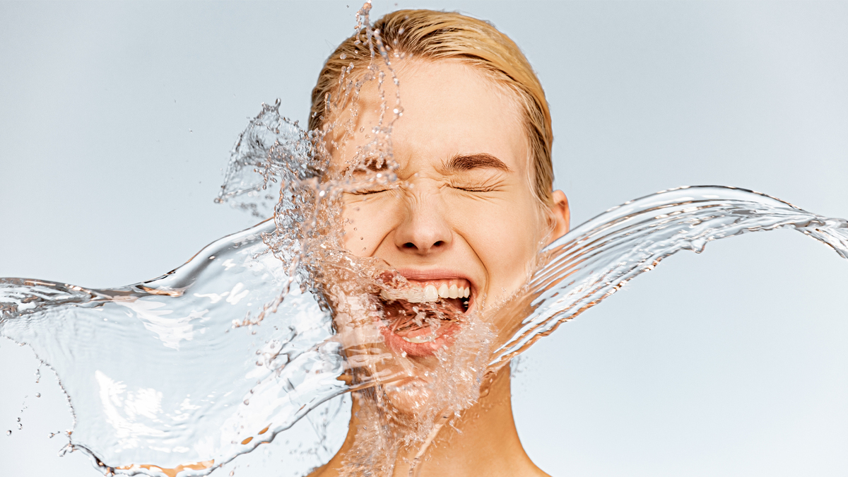 Photo,Of,Screaming,Woman,With,Drops,Of,Water,Around,Her