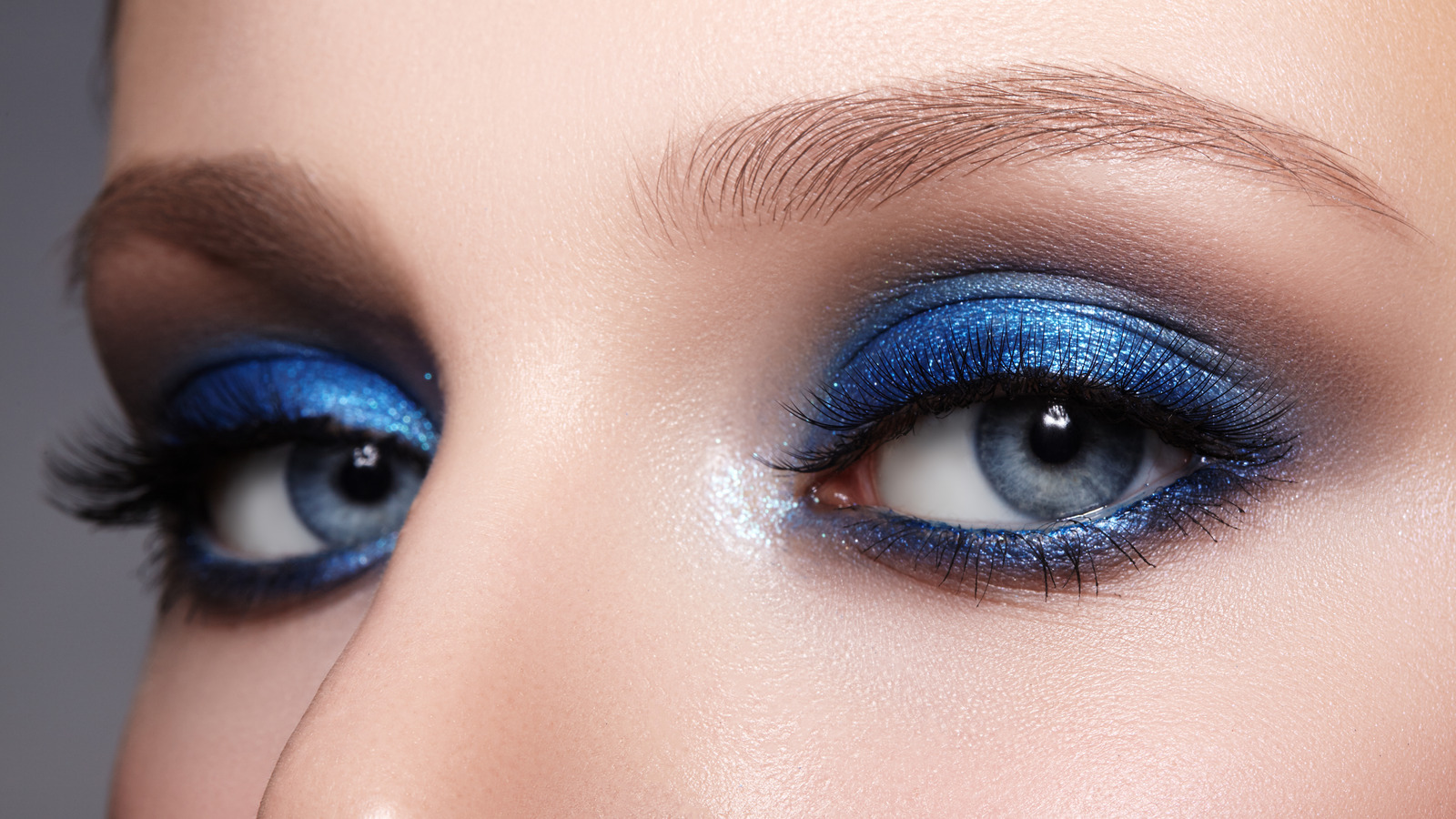 Closeup,macro,of,woman,face,with,blue,eyes,make Up.,fashion